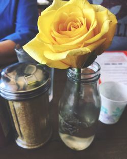 Close-up of flowers in jar on table