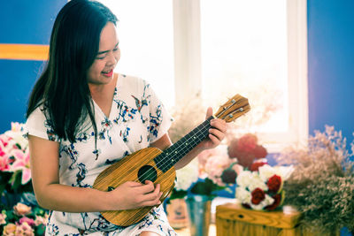 Woman holding guitar