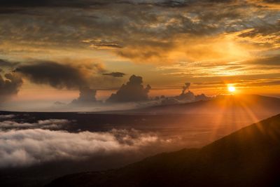 From the top of mauna kea, big island hawaii the sun fades off into the distance. 