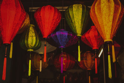 Colorful lanterns hanging for sale at market stall