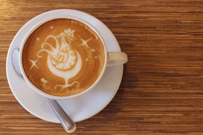 High angle view of cappuccino on table