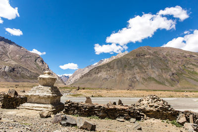 Scenic view of rocky mountains against blue sky