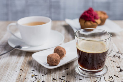 Coffee and cookies on table