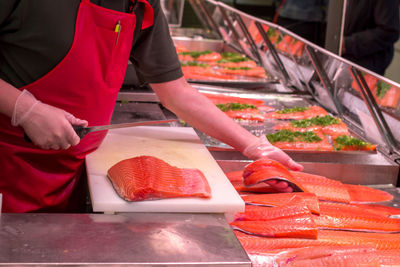 Midsection of man preparing food