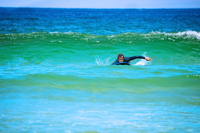 Man swimming in sea