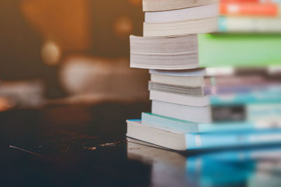 Close-up of books stacked on table