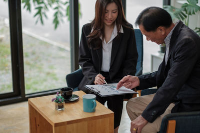 Business colleagues working in office