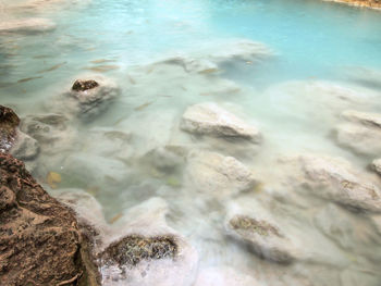 High angle view of rocks in sea