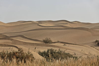 Scenic view of desert against clear sky