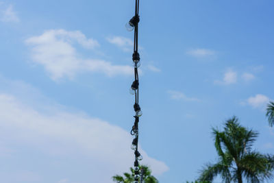 Low angle view of communications tower against sky