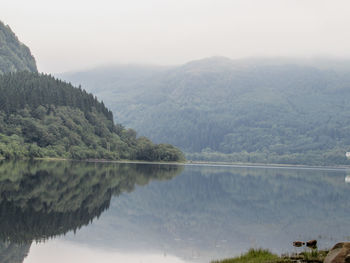 Scenic view of lake with mountains in background