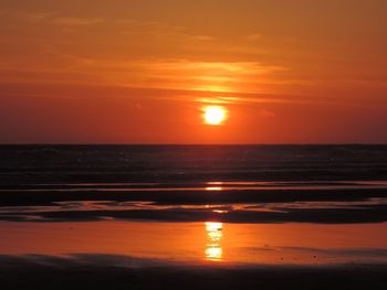 Scenic view of sea at sunset