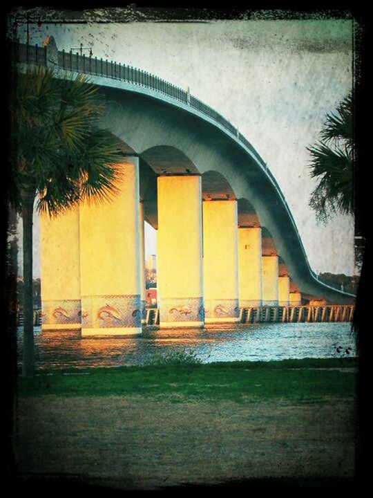 architecture, built structure, building exterior, arch, tree, transfer print, auto post production filter, architectural column, city, sky, building, outdoors, park - man made space, bridge - man made structure, day, grass, lawn, no people, incidental people, sunlight