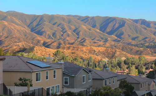 High angle view of houses and mountains against sky