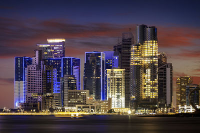 Illuminated buildings in city at night