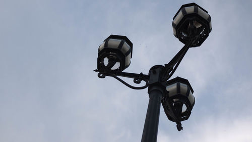 Low angle view of street light against sky