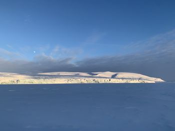 Scenic view of snowcapped mountain against sky