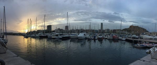 Boats moored at harbor