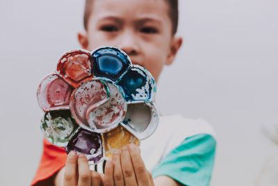 Close-up portrait of boy holding ice cream