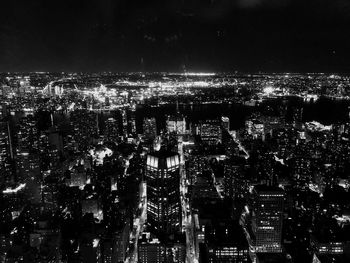 High angle view of illuminated buildings in city at night