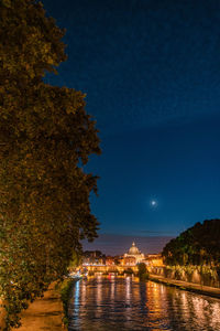 View of illuminated city at waterfront