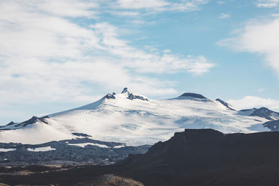 Scenic view of snowcapped mountains against sky