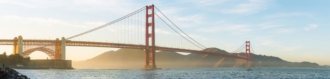 View of suspension bridge over sea