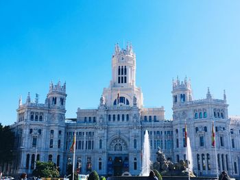 Low angle view of building against blue sky