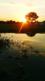 Scenic view of sunset over lake