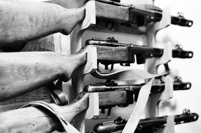 Close-up of rifles on rack