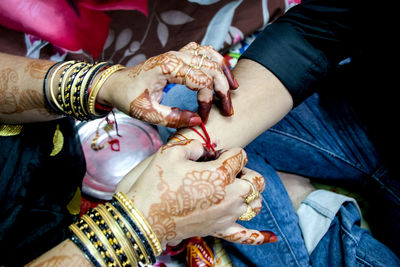 High angle view of people holding hands