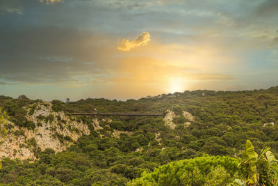 Scenic view of landscape against sky during sunset