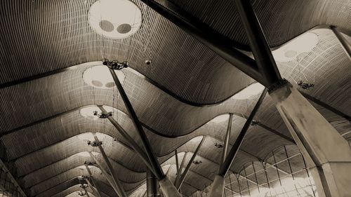 Low angle view of lighting equipment hanging on ceiling