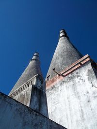 Low angle view of building against blue sky