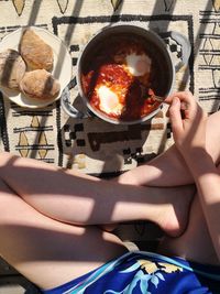 High angle view of woman holding ice cream