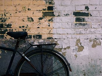 Bicycle parked against wall