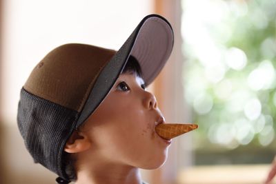 Close-up portrait of boy holding ice cream