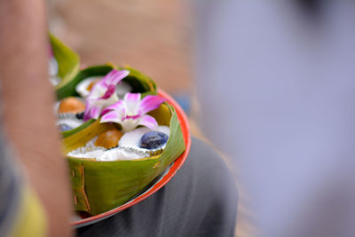 Close up delicious thai dessert in banana leaves on metal tray with copy space.