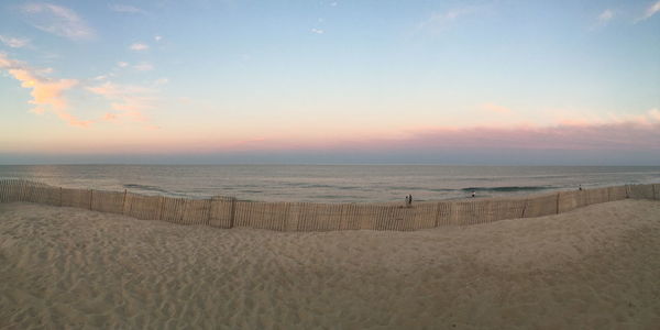 Scenic view of beach at sunset