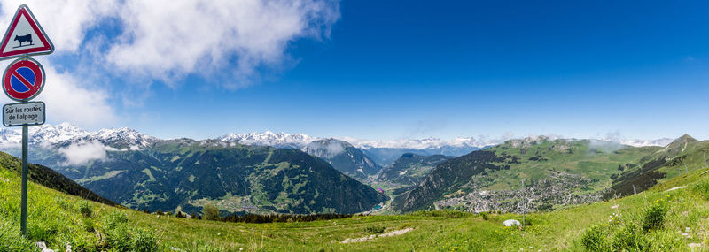 Scenic view of mountains against cloudy sky