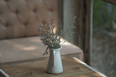 Close-up of flower vase on table