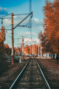 Railroad tracks against sky during autumn