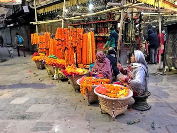 People at market stall