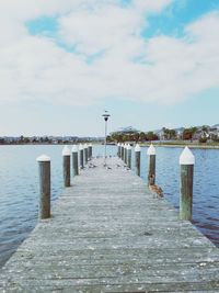 Pier over sea against sky