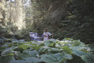 Woman sitting in a forest