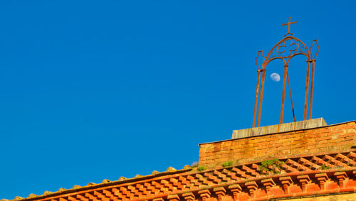 Low angle view of building against blue sky