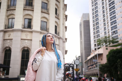 Full length of woman standing in city