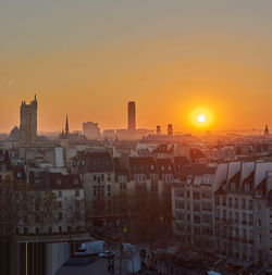 High angle view of buildings against sky during sunset