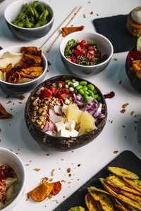 Variety of bowls of hawaiian food.