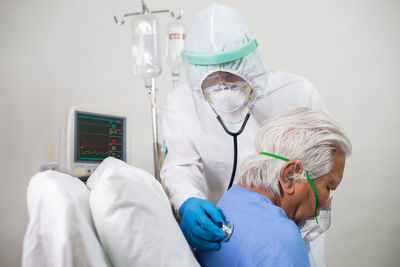 Midsection of man with arms raised